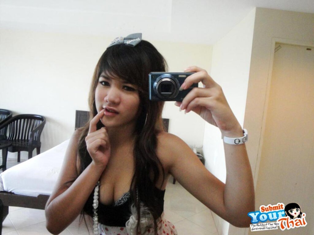 Min with finger raised to her lips self shot cleavage