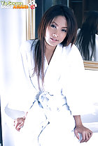 Ya Soraya seated in bathroom wearing white robe long hair