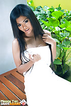 Meena Yen sitting on bench long hair wearing towel