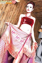 Wearing crop top holding sarong