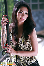 Long hair falling over her leopard print top