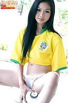 Lin Si Yee seated on football legs open in panties long hair over her brazil shirt