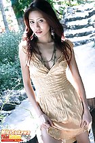 Raising hem of dress standing on path