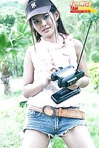 Playing with controller wearing denim shorts