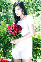 Wearing transparent dress holding bunch of roses