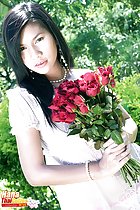 Hana holding roses long hair pearl necklace