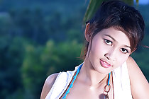 Cutie Tar Chang stripping on hamock baring pert small breasts
