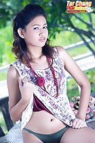 Tar Chang raising hem of her dress exposing her panties