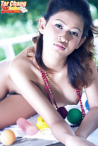 Lying on table naked hint of pussy hair between her legs