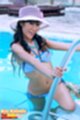 Nee nalinda climbing out of swimming pool wearing sun hat in bikini