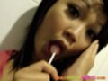 Febe surprised enjoying sucking lollipop a little too much