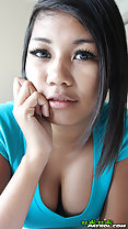 Bee propping her face up with her hand showing cleavage