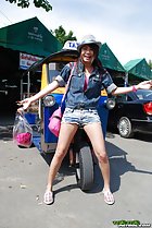 Standing in front of tuktuk