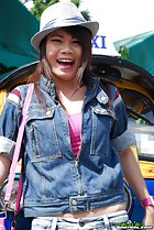 Standing in front of tuktuk